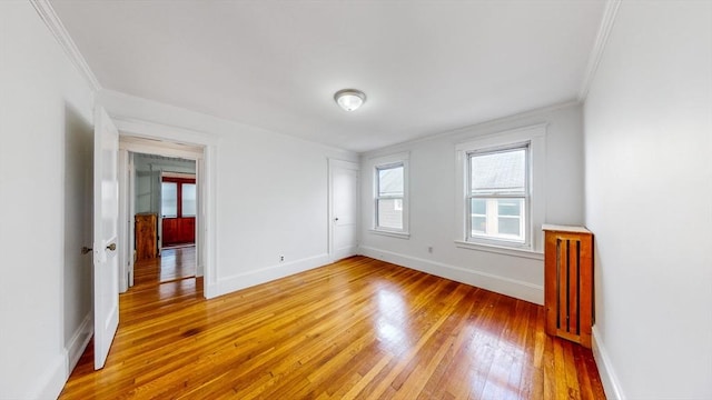 235-237 Corey Rd, Boston, MA 02135 - empty room featuring ornamental molding and light wood-style flooring