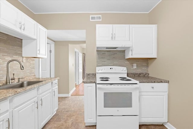 kitchen with electric stove, visible vents, white cabinetry, a sink, and under cabinet range hood