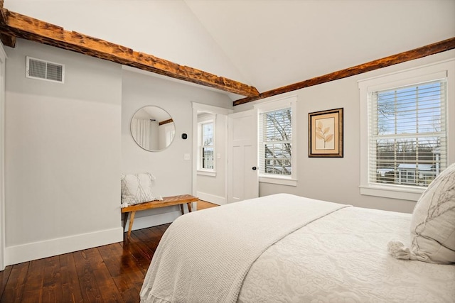 bedroom featuring dark wood-style flooring, visible vents, vaulted ceiling, and multiple windows