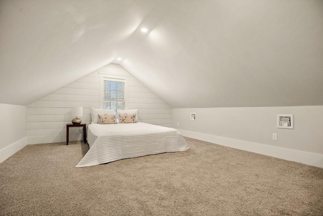 bedroom featuring vaulted ceiling, carpet, and baseboards