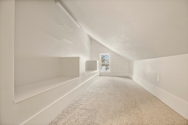 bonus room featuring lofted ceiling