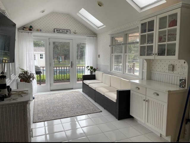 sunroom / solarium with a skylight and french doors