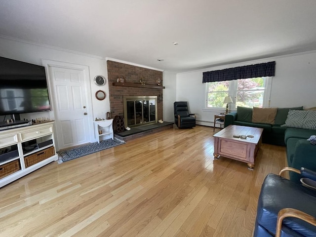 living area with a baseboard radiator, wood finished floors, crown molding, and a brick fireplace