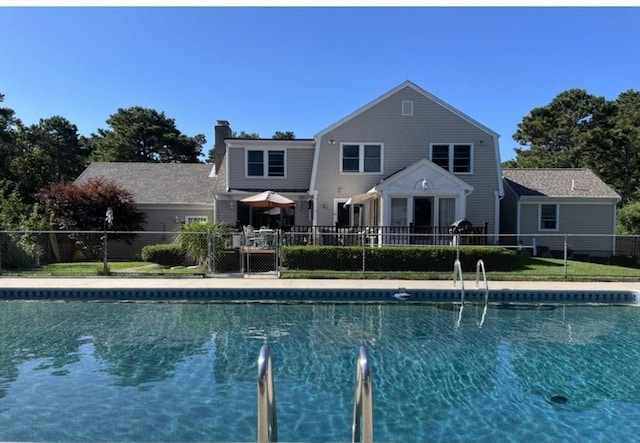 view of pool with fence and a fenced in pool