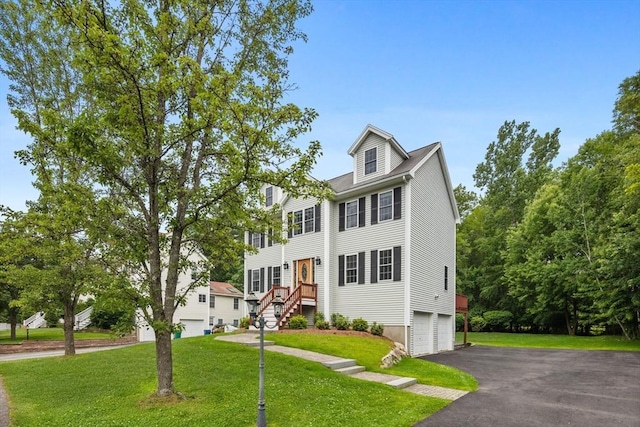 7 Suzannah Rd, Billerica, MA 01862 - view of front of house with a front lawn, asphalt driveway, and a garage