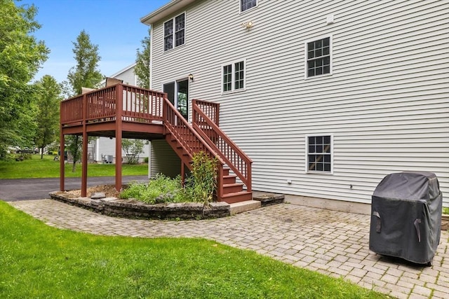 7 Suzannah Rd, Billerica, MA 01862 - rear view of house featuring a wooden deck, a patio area, stairs, and a yard
