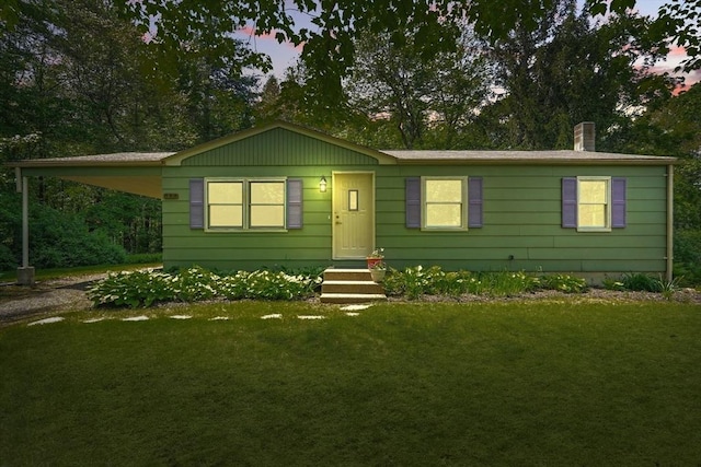 161 Farmington Rd, Amherst, MA 01002 - view of front of house featuring a front yard, driveway, a chimney, and a carport