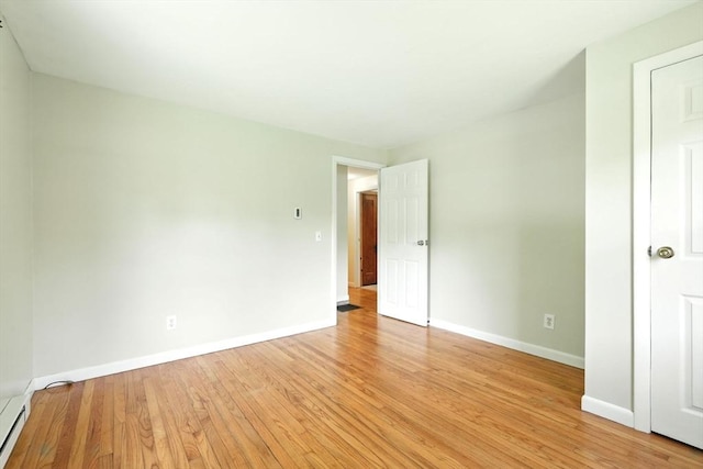 161 Farmington Rd, Amherst, MA 01002 - unfurnished bedroom featuring light wood-type flooring, baseboards, and a baseboard radiator