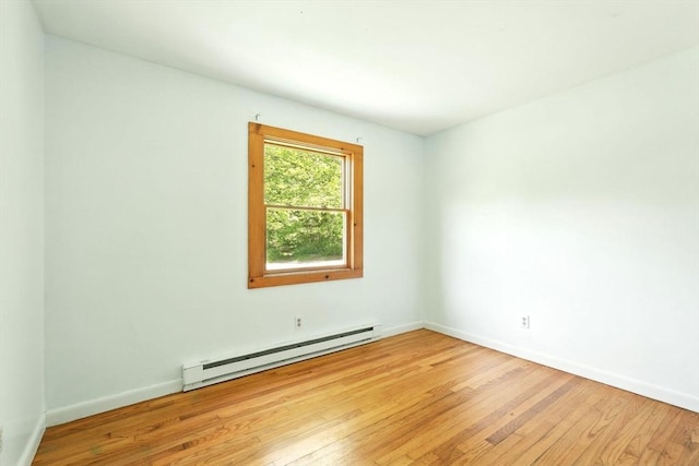 161 Farmington Rd, Amherst, MA 01002 - spare room with baseboard heating, light wood-style flooring, and baseboards