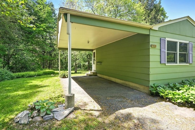 161 Farmington Rd, Amherst, MA 01002 - view of property exterior featuring a lawn, driveway, and a carport