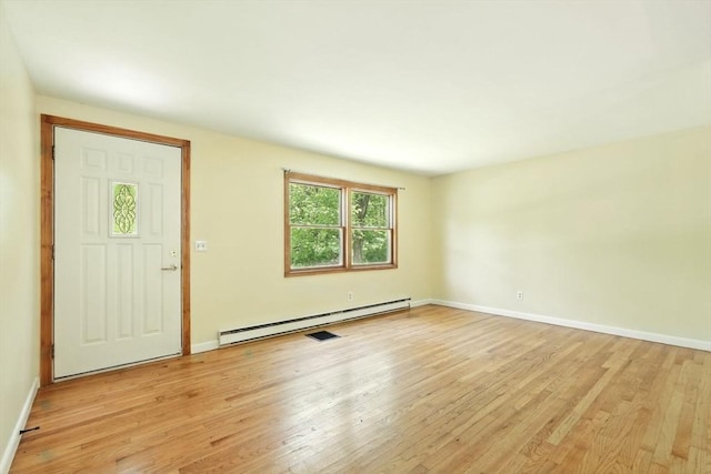161 Farmington Rd, Amherst, MA 01002 - entryway with a baseboard radiator, light wood-type flooring, and baseboards