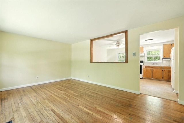 161 Farmington Rd, Amherst, MA 01002 - empty room with light wood-type flooring, baseboards, and ceiling fan