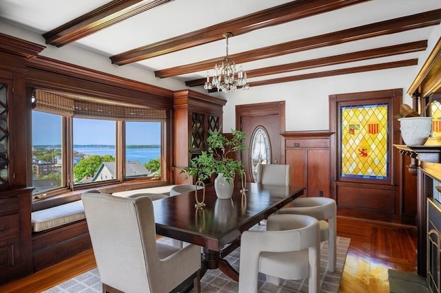 2 Bluff Rd, Hull, MA 02045 - dining room with beam ceiling, a chandelier, and wood finished floors