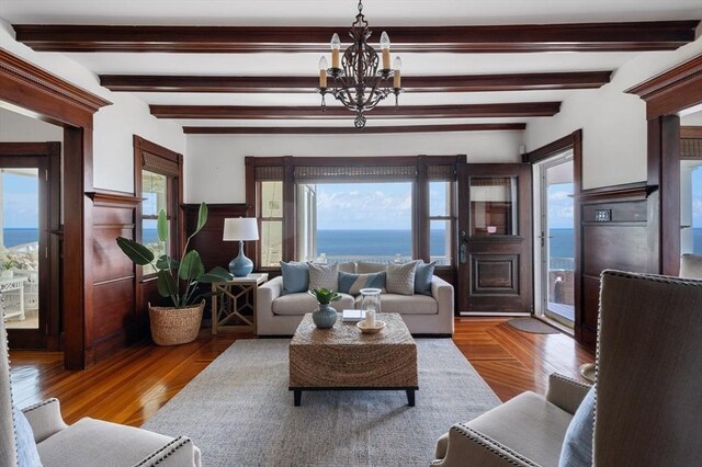 2 Bluff Rd, Hull, MA 02045 - living room with a chandelier and beam ceiling