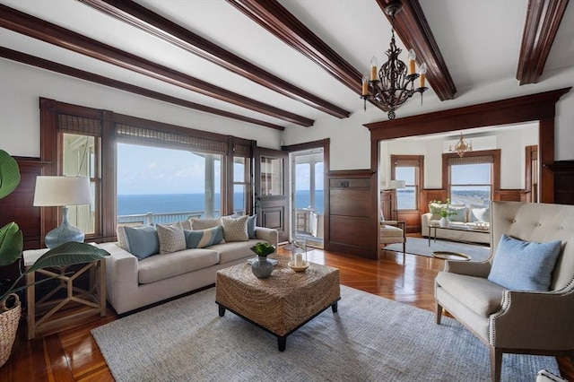 2 Bluff Rd, Hull, MA 02045 - living room with a chandelier, beam ceiling, a wainscoted wall, wood finished floors, and a water view