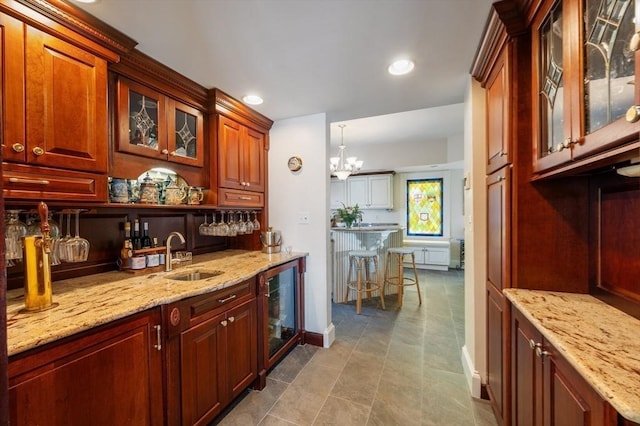 2 Bluff Rd, Hull, MA 02045 - indoor wet bar featuring beverage cooler, a chandelier, baseboards, and recessed lighting
