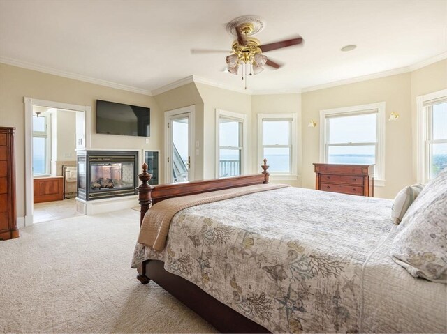 2 Bluff Rd, Hull, MA 02045 - bedroom with light colored carpet, ornamental molding, a multi sided fireplace, and a ceiling fan