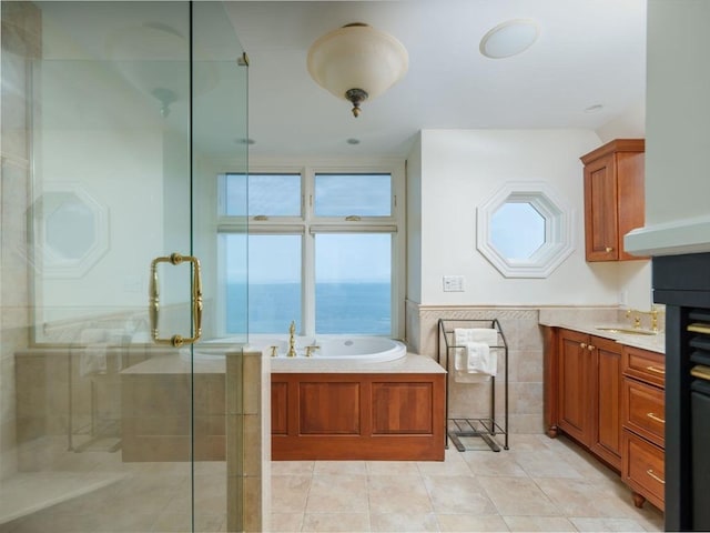 2 Bluff Rd, Hull, MA 02045 - bathroom with tile walls, a shower stall, a garden tub, tile patterned flooring, and vanity