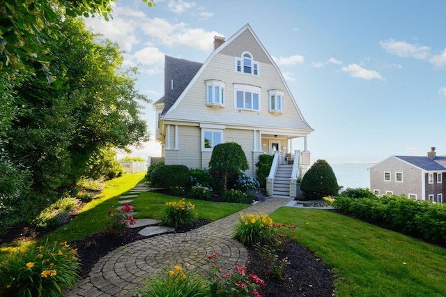 2 Bluff Rd, Hull, MA 02045 - view of front of property with stairs, a front lawn, and a chimney