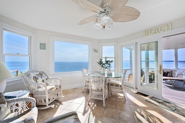 2 Bluff Rd, Hull, MA 02045 - sunroom with plenty of natural light, tile patterned floors, baseboards, and a water view