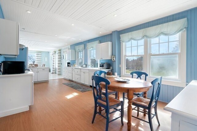 dining area with light hardwood / wood-style floors