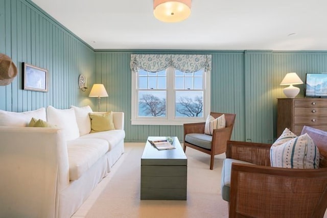 living room with crown molding and carpet floors