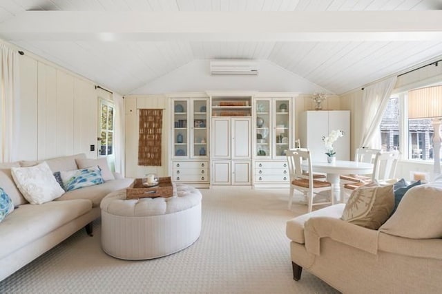 carpeted living room with a wall mounted air conditioner and lofted ceiling with beams