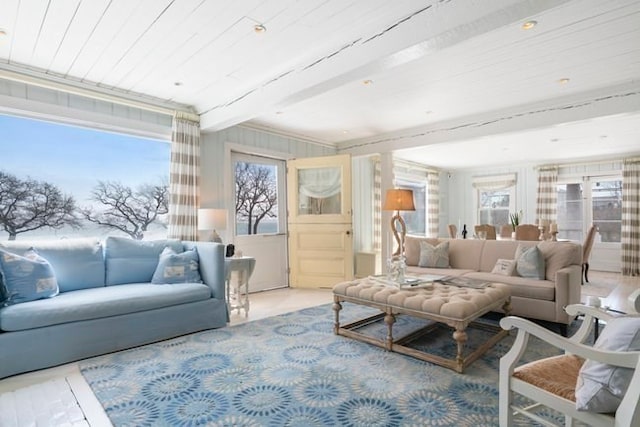 living room with beamed ceiling and plenty of natural light