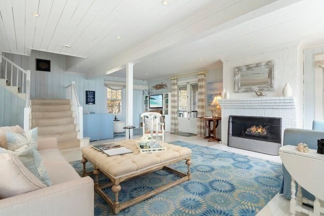 living room featuring a healthy amount of sunlight and crown molding