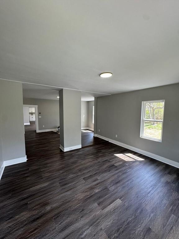 32 Main St, Monson, MA 01057 - unfurnished living room featuring dark wood-type flooring