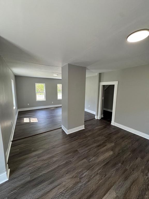 32 Main St, Monson, MA 01057 - empty room featuring dark wood-style floors and baseboards