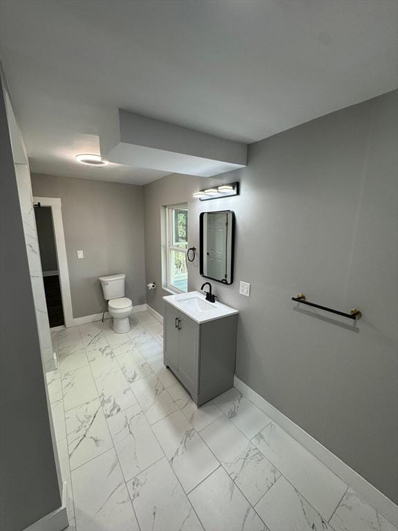 32 Main St, Monson, MA 01057 - bathroom featuring marble look tiles and vanity