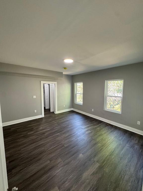 32 Main St, Monson, MA 01057 - spare room featuring baseboards and dark wood finished floors