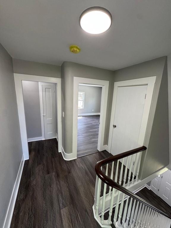 32 Main St, Monson, MA 01057 - hallway featuring wood finished floors and an upstairs landing