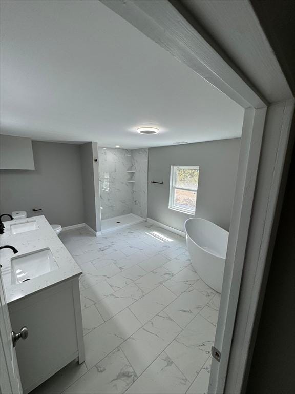 32 Main St, Monson, MA 01057 - full bathroom featuring marble look tiles, double vanity, a marble finish shower, and a soaking tub