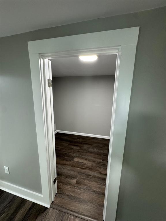 32 Main St, Monson, MA 01057 - corridor with dark wood finished floors and baseboards