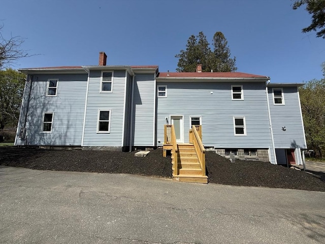 32 Main St, Monson, MA 01057 - rear view of property featuring a chimney
