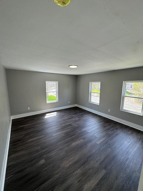 32 Main St, Monson, MA 01057 - unfurnished room with dark wood-style flooring and baseboards