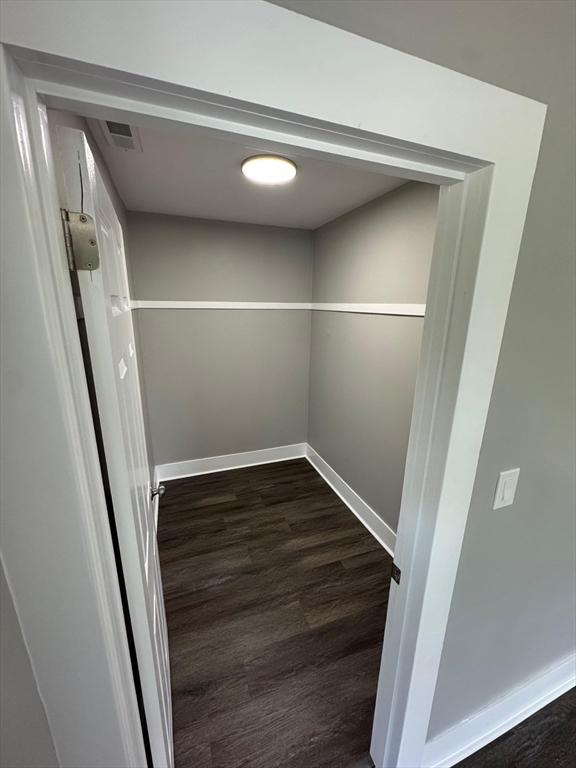 32 Main St, Monson, MA 01057 - walk in closet with dark wood-type flooring