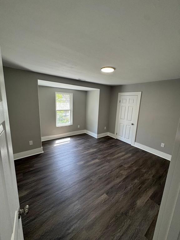 32 Main St, Monson, MA 01057 - empty room featuring baseboards and dark wood finished floors