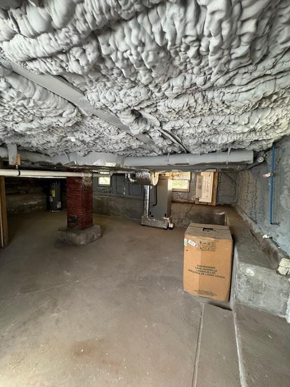 32 Main St, Monson, MA 01057 - basement featuring water heater and heating unit
