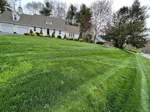 view of yard featuring a garage