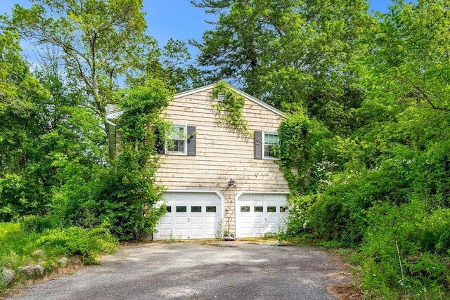 445 Salem St, North Andover, MA 01845 - view of side of property with a garage and asphalt driveway