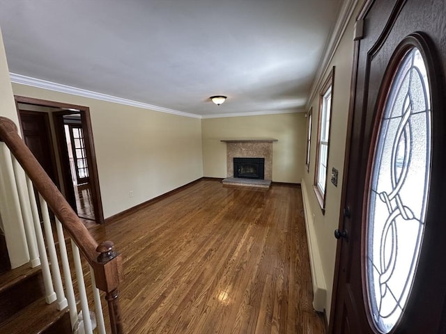 entryway featuring ornamental molding and hardwood / wood-style floors