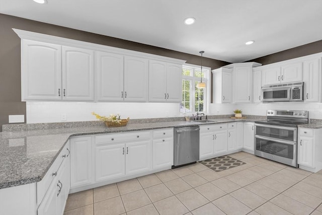18 Preserve Way, Sturbridge, MA 01566 - kitchen featuring appliances with stainless steel finishes, decorative light fixtures, white cabinetry, and recessed lighting