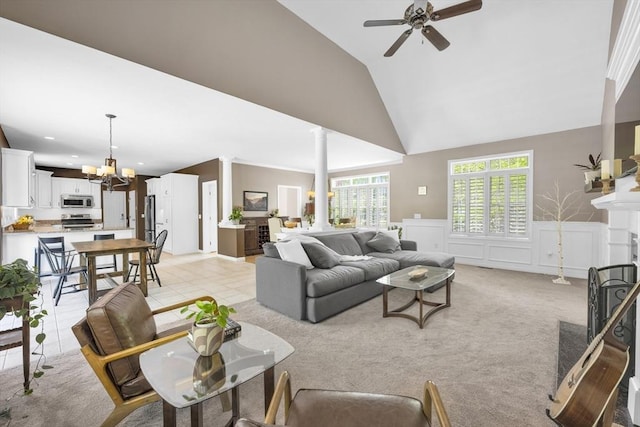 18 Preserve Way, Sturbridge, MA 01566 - living area with ornate columns, ceiling fan, a fireplace, high vaulted ceiling, and a chandelier