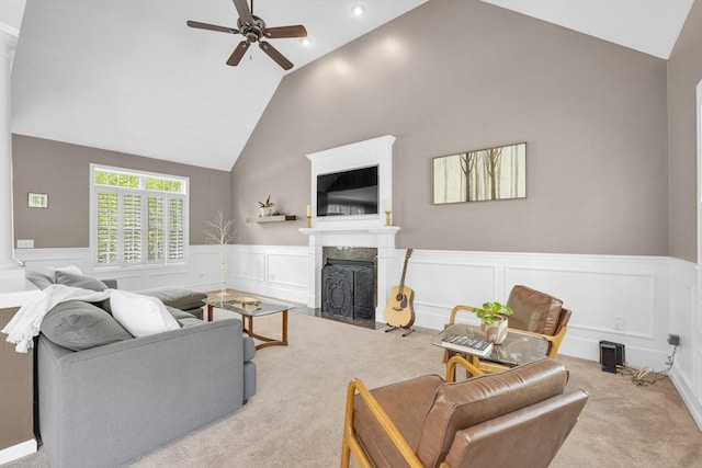 18 Preserve Way, Sturbridge, MA 01566 - living area with ceiling fan, carpet flooring, a fireplace with flush hearth, wainscoting, and high vaulted ceiling