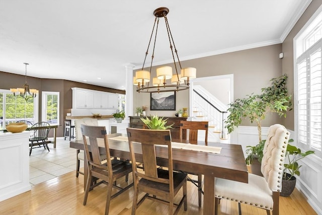 18 Preserve Way, Sturbridge, MA 01566 - dining room featuring a chandelier, stairs, healthy amount of natural light, crown molding, and wainscoting