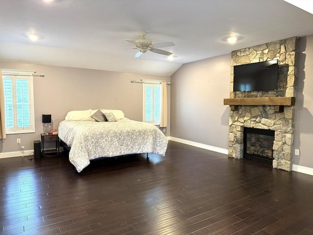18 Preserve Way, Sturbridge, MA 01566 - bedroom with multiple windows, vaulted ceiling, baseboards, wood finished floors, and a stone fireplace