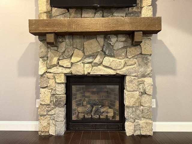18 Preserve Way, Sturbridge, MA 01566 - detailed view of baseboards, a stone fireplace, and wood finished floors
